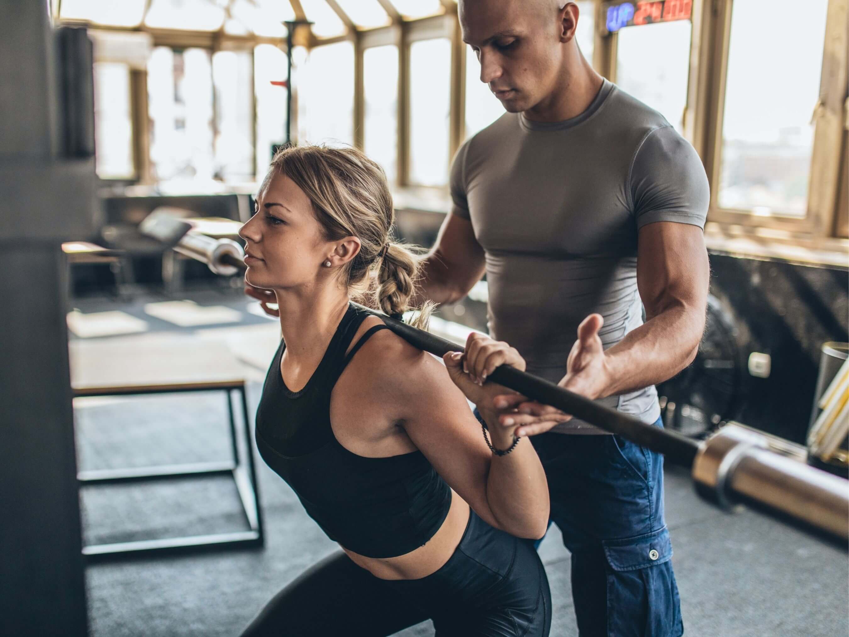 woman working with personal trainer